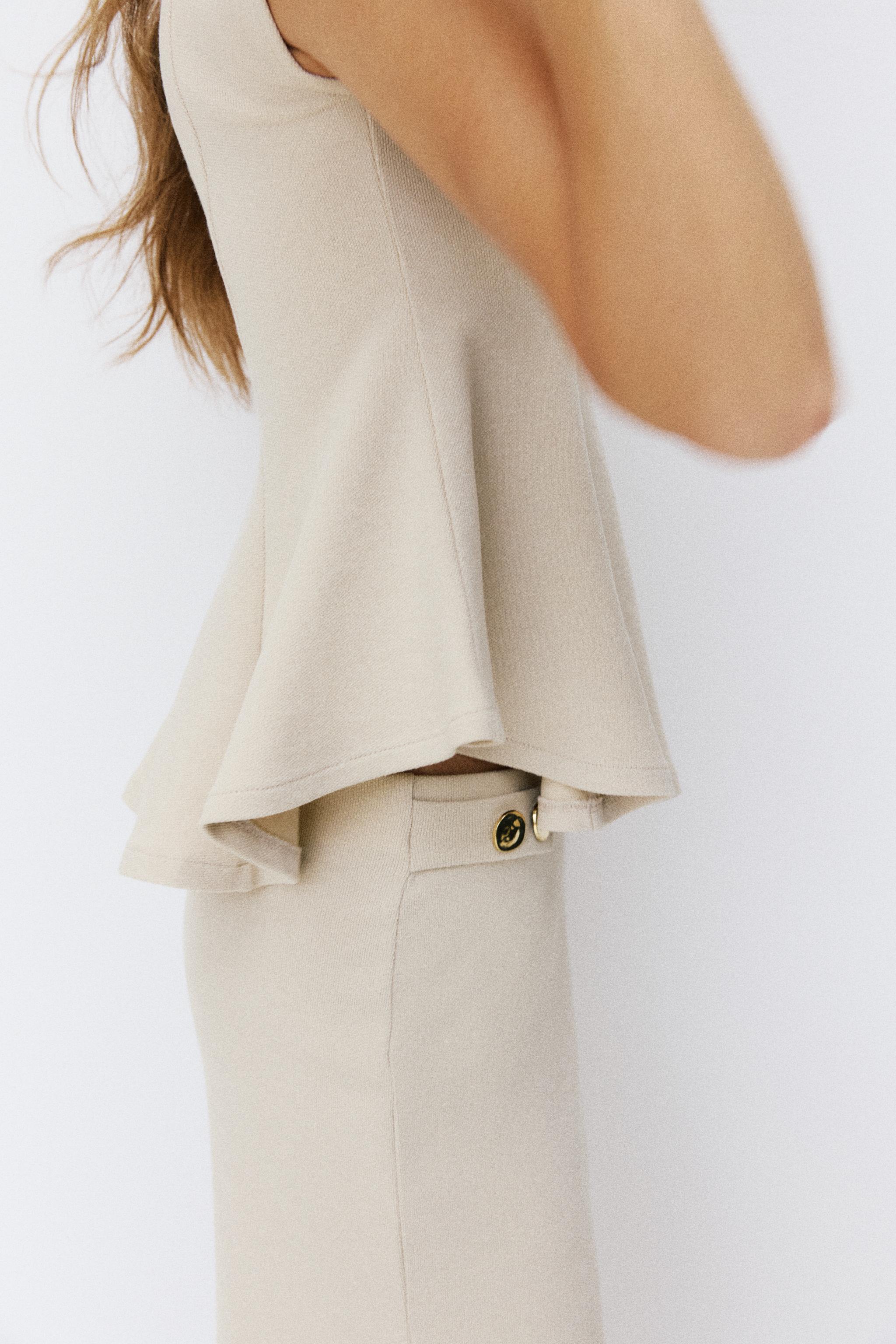 SHORT SLEEVE PIQUÉ PEPLUM TOP